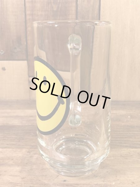 スマイルフェイスが描かれたガラス製の70’sヴィンテージジョッキグラス