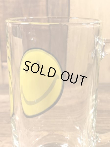 スマイルフェイスが描かれたガラス製の70’sヴィンテージジョッキグラス