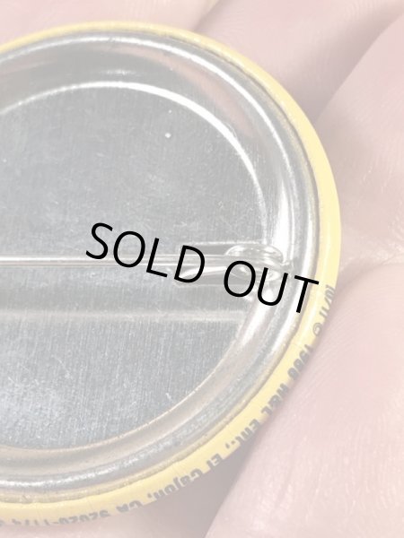 “The One With The Most Buttons Wins”と書かれたスマイルの80年代ビンテージ缶バッジ