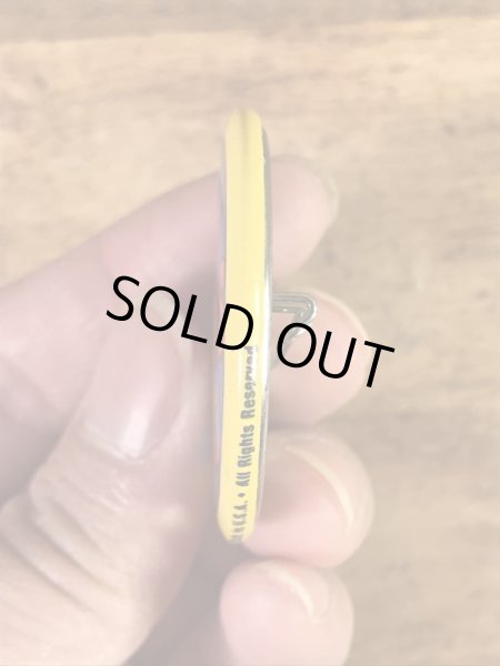 “The One With The Most Buttons Wins”と書かれたスマイルの80年代ビンテージ缶バッジ