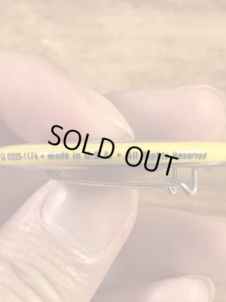 “The One With The Most Buttons Wins”と書かれたスマイルフェイスの80’sヴィンテージ缶バッチ