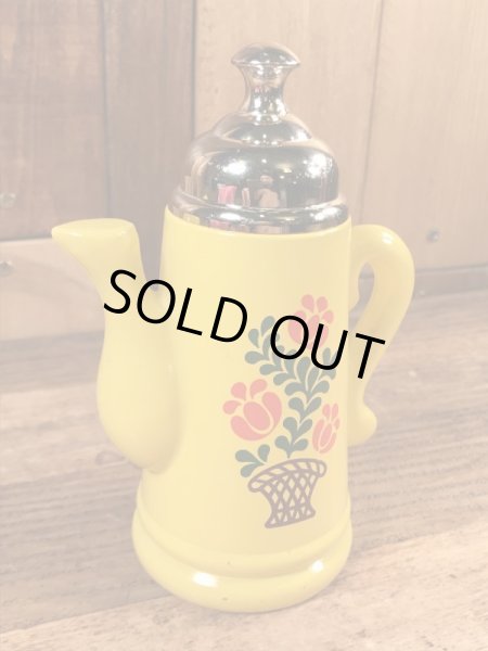 エイボン社製の花の絵が付いたポットの70年代ビンテージ容器