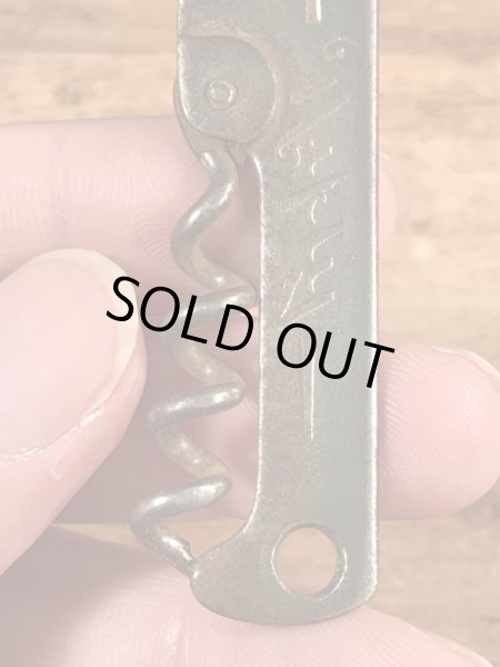 企業物の折り畳みのコークスクリューが付いたヴィンテージボトルオープナー