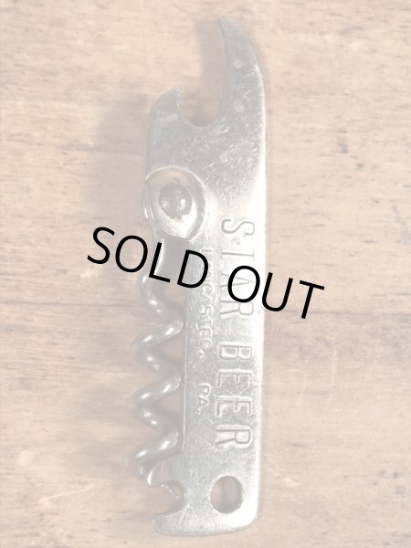 スタービールの折り畳みのコークスクリューが付いたビンテージ栓抜き