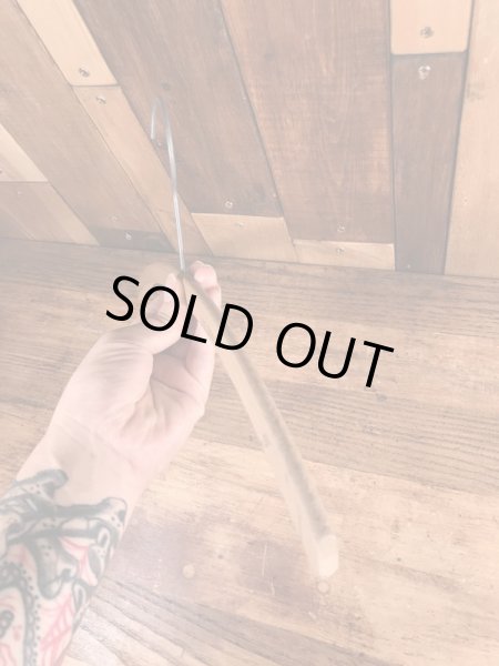 アメリカの企業物のアンティークのウッドハンガー