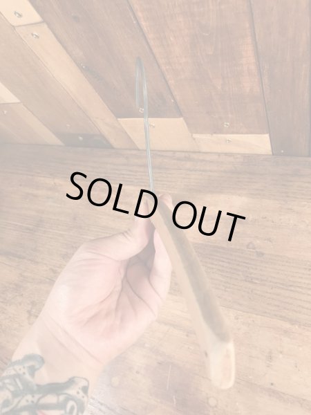 アメリカの企業物のアンティークのウッドハンガー