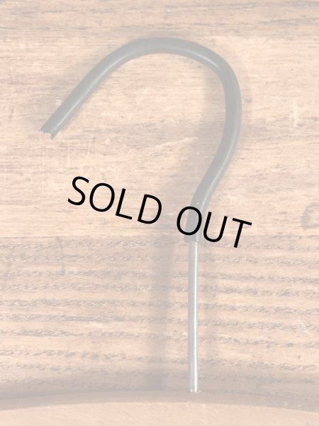 アメリカの企業物のアンティークのウッドハンガー