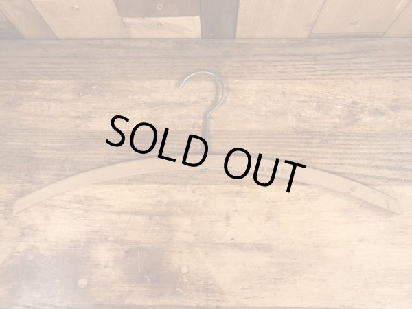 アメリカの企業物のアンティークのウッドハンガー