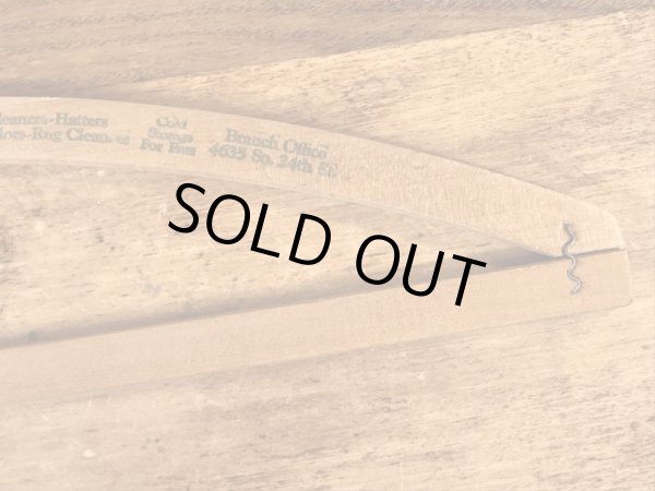 アメリカの企業物のアンティークのウッドハンガー