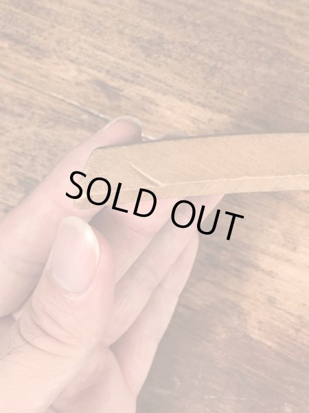 アメリカの企業物のアンティークのウッドハンガー