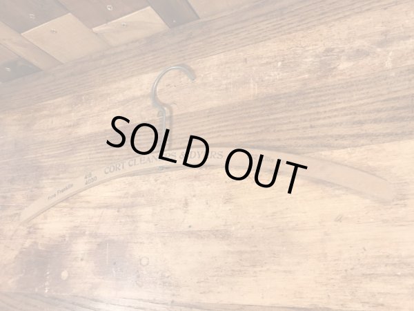 アメリカの企業物のアンティークのウッドハンガー