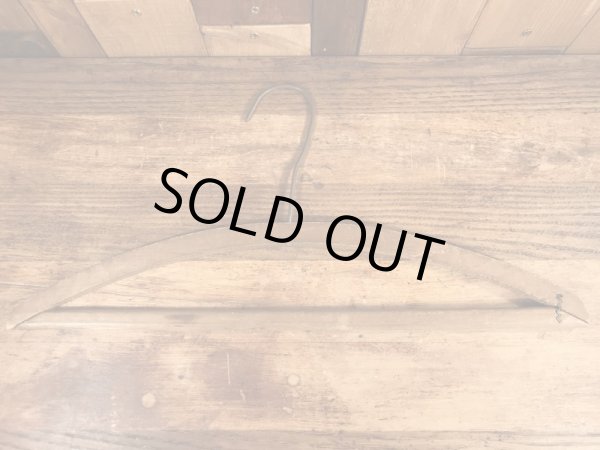 アメリカの企業物のアンティークのウッドハンガー