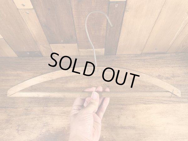 アメリカの企業物のアンティークのウッドハンガー