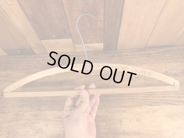 アメリカの企業物のアンティークのウッドハンガー