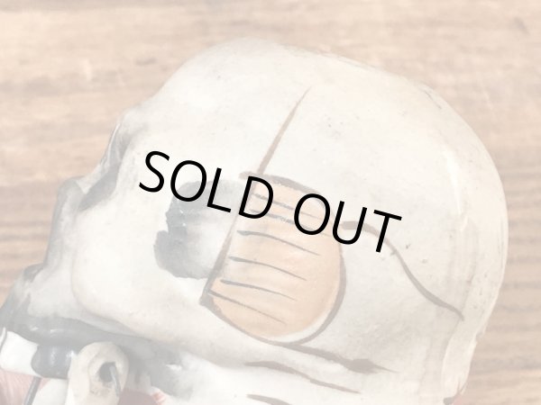 スカルオンブックの顎揺れするビンテージマッチホルダー