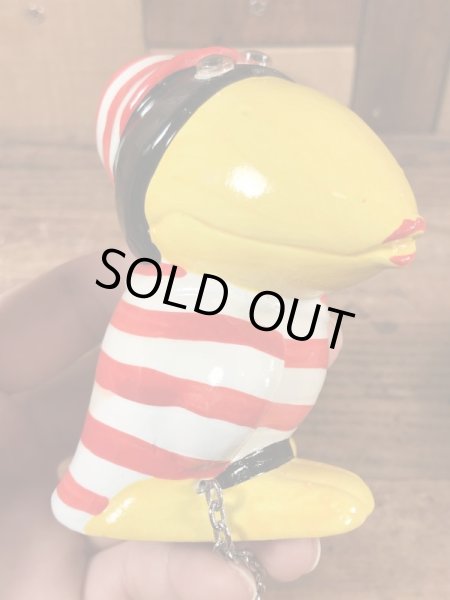 檻に入った囚人の鳥のヴィンテージコインバンクドール