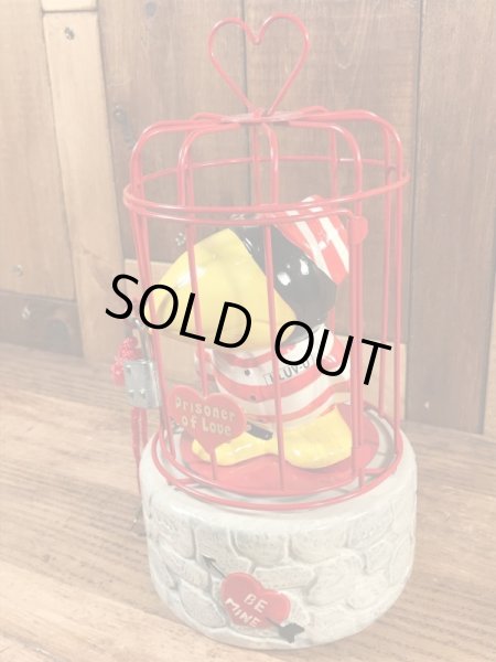 檻に入った囚人の鳥のヴィンテージコインバンクドール