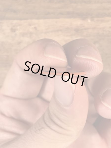 スマイルの顔が描かれたヴィンテージタブバッチ