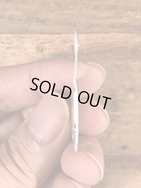 スマイルの顔が描かれたビンテージタブバッジ