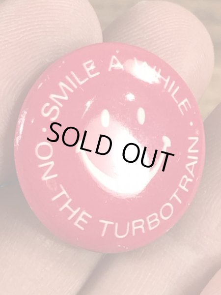 スマイルの顔とメッセージが書かれたビンテージ缶バッジ