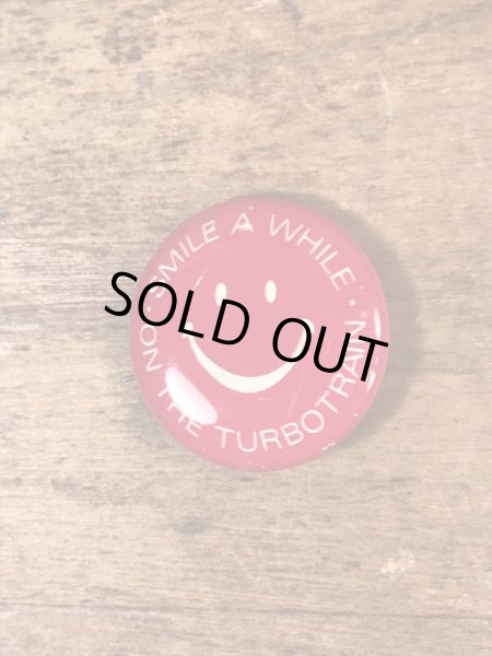 スマイルフェイスの企業物のヴィンテージ缶バッチ