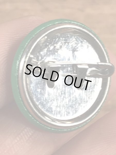 目がクローバーになったスマイルフェイスのヴィンテージ缶バッチ