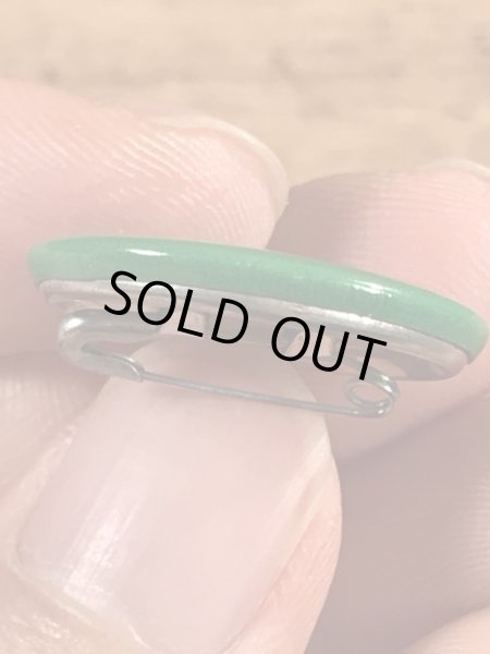 目がクローバーになったスマイルフェイスのヴィンテージ缶バッチ