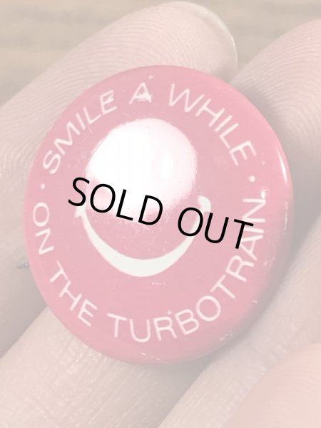 スマイルフェイスの企業物のヴィンテージ缶バッチ