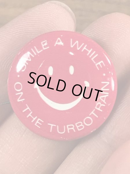 スマイルの顔とメッセージが書かれたビンテージ缶バッジ