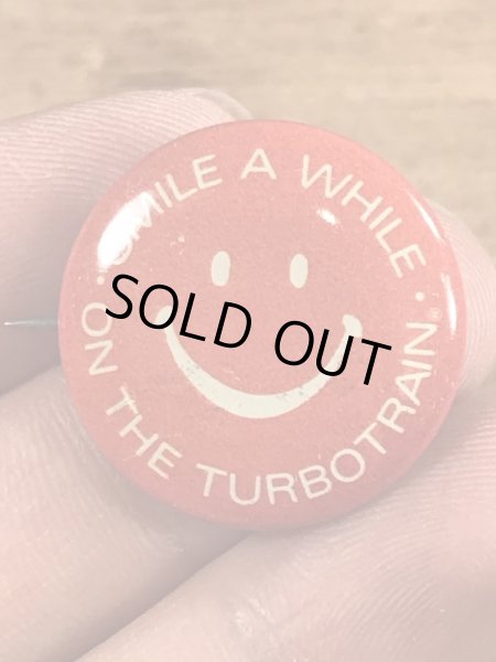 スマイルの顔とメッセージが書かれたビンテージ缶バッジ