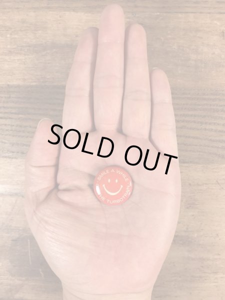 スマイルの顔とメッセージが書かれたビンテージ缶バッジ