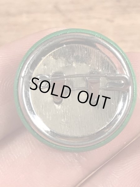 目がクローバーになったスマイルフェイスのヴィンテージ缶バッチ