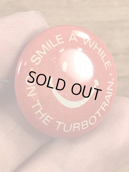 スマイルの顔とメッセージが書かれたビンテージ缶バッジ