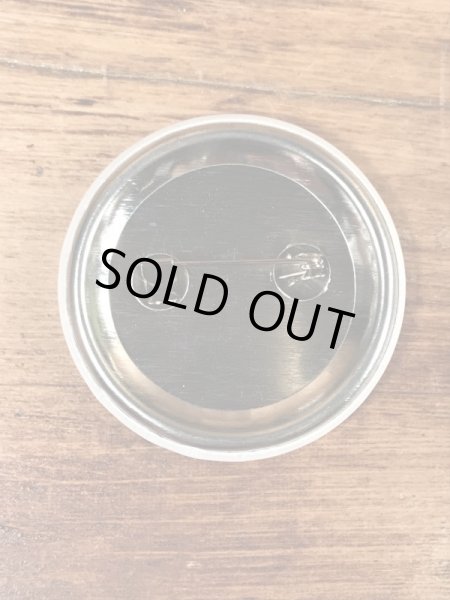 目がクローバーになったスマイルフェイスのヴィンテージ缶バッチ