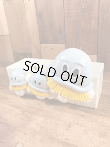 企業キャラクターのスクラビングバブルのヴィンテージバスタブオーガナイザー