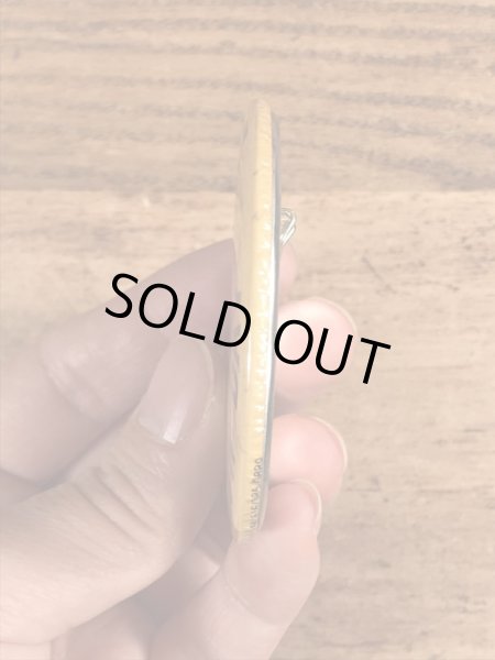 70年代頃の企業物のスマイルフェイスのビンテージの缶バッジ