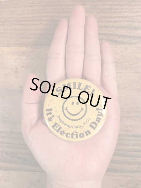 70年代頃の企業物のスマイルのビンテージの缶バッジ