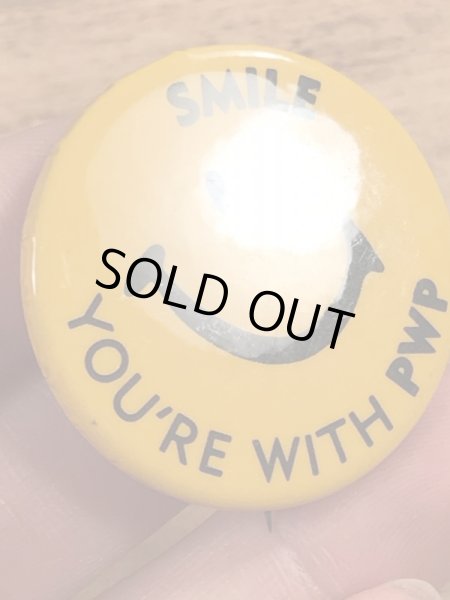 70年代頃の企業物のスマイルのビンテージの缶バッジ