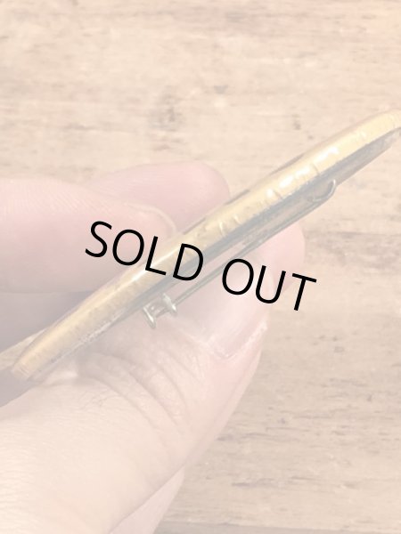 70年代頃の企業物のスマイルフェイスのビンテージの缶バッジ