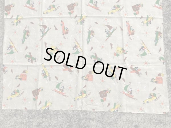 60~70年代頃の乗り物に乗ったミッキーマウスのビンテージの端切れ布