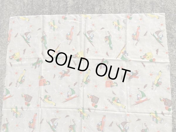 60~70年代頃の乗り物に乗ったミッキーマウスのビンテージの端切れ布