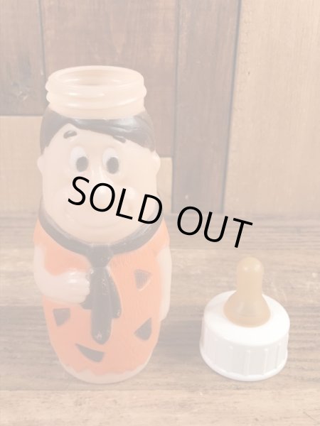 70年代頃のフリントストーンのフレッドのビンテージの哺乳瓶フィギュア