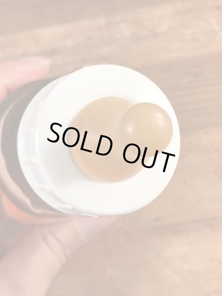 70年代頃のフリントストーンのフレッドのビンテージの哺乳瓶フィギュア