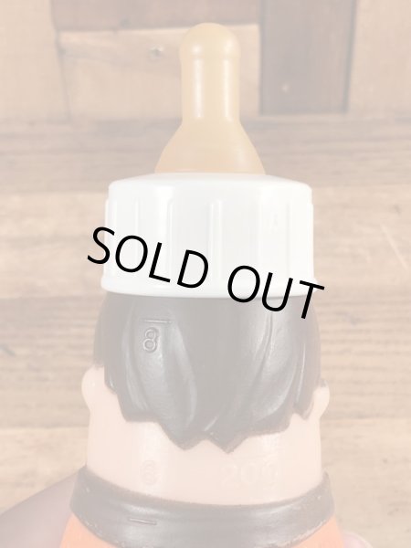 70年代頃のフリントストーンのフレッドのビンテージの哺乳瓶フィギュア