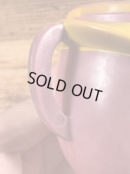 アドバタイジングキャラクターのファニーフェイスのビンテージのマグカップ