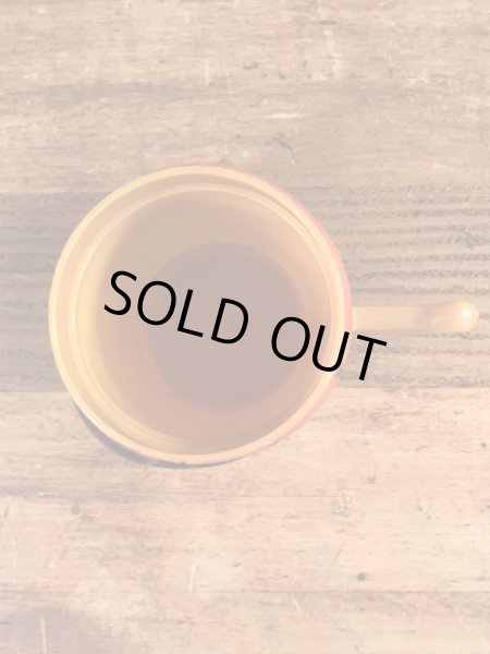 企業キャラクターのファニーフェイスのビンテージのマグカップ