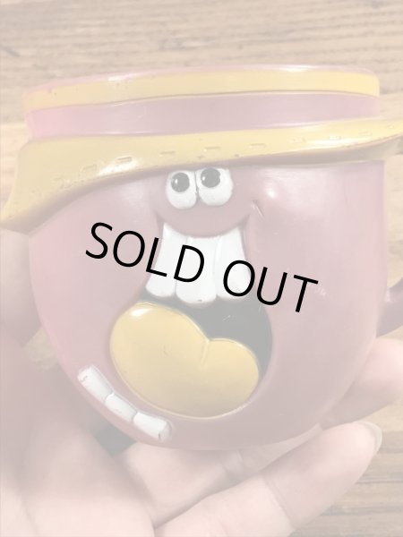 アドバタイジングキャラクターのファニーフェイスのビンテージのマグカップ