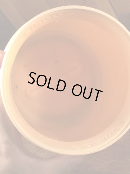 企業キャラクターのハッピージャックスのビンテージのクッキーコンテナー