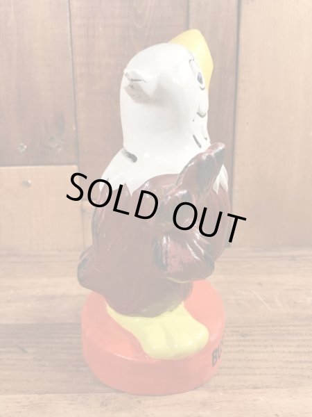 ブッシュガーデンのアドバタイジングキャラクターのビンテージのコインバンクドール