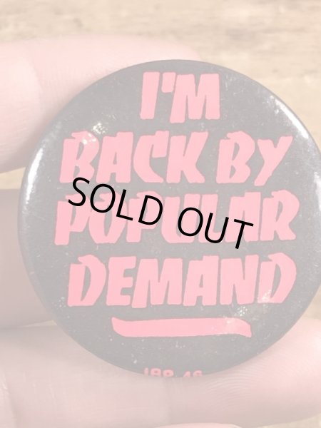 80年代頃のI'm Back By Popular Demandのメッセージが書かれたビンテージの缶バッジ